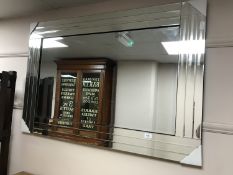 An all glass bevelled mirror,