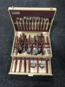 A canteen of stainless steel teak handled cutlery by Glosswood of Sheffield