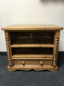 A pine audio stand fitted a drawer