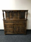 A carved oak court cupboard