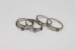 18ct white gold puzzle ring 9 diamonds 8.