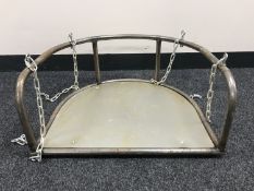 A vintage style metal fairground swing