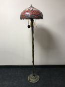 A Tiffany style standard lamp with leaded dragonfly shade