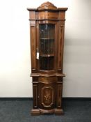 An Italianate corner display cabinet