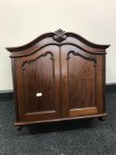 An Edwardian mahogany double door wall cabinet