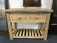 A reclaimed pine kitchen prep table fitted with two drawers