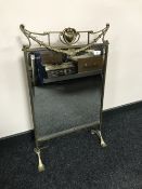 An early 20th century brass framed Art Nouveau mirrored fire screen