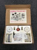A boxed pebble and gem polisher