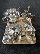 A tray containing a collection of silver plated wares including three-branch candelabra,