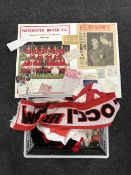 A framed Manchester United collage with tickets and programmes dating from the mid twentieth