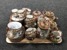 A tray containing Japanese egg shell tea china