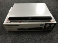 A boxed Panasonic Blu-ray disk recorder with remote
