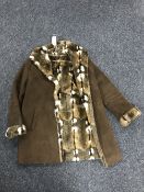 A ladies coat with a faux fur lining