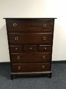 A Stag seven drawer chest in a mahogany finish