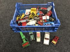 A crate containing mid twentieth century and later die cast and tin plate vehicles, including Dinky,