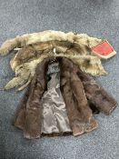 A ladies fur coat with wrap,