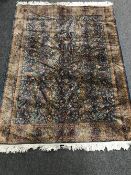 A ghom design rug on blue ground,