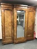 A Victorian burr walnut triple door wardrobe,