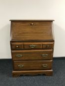 A contemporary bureau fitted three drawers