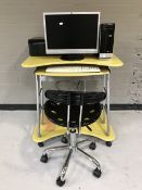 A computer desk with swivel chair, HP Pavilion slim line disk drive, monitor,