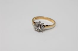 An 18ct gold diamond cluster ring
