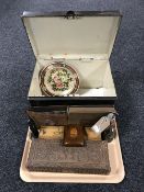 A tray containing a vintage tin box, black and white photograph albums, a carved trinket box,