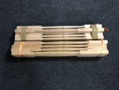 Two bundles of pine banister spindles