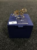 A boxed Swarovski Crystal Society figure, Lion Cub Standing, with certificate.