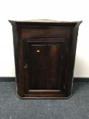 A Victorian oak hanging corner cupboard