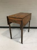 An early twentieth century mahogany drop leaf table,