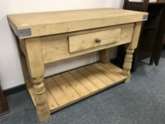 A reclaimed pine butcher's block fitted with a drawer,