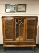 A continental glazed walnut side cabinet on pad feet, width 140 cm.