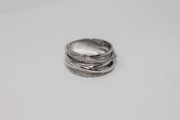 An Al Coro Serenata 18ct white gold multi-shank diamond encrusted crossover ring, size O/P, 10.