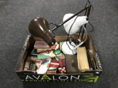 A box containing two anglepoise lamps, stationary, oil paints, drawing instruments,
