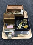 A tray containing a cigar box containing black and white photographs,