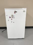 A Hairer under bench fridge