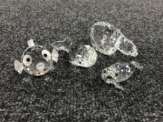 Four un-boxed Swarovski Crystal figures; polar bear, seal,