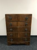 A mid twentieth century walnut bow fronted chest
