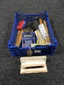 A basket containing assorted drawing instruments, rulers, calculators,