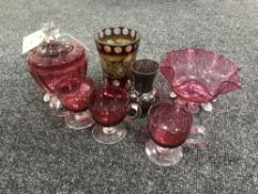 A small group of cranberry glass,