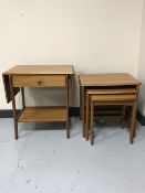 A nest of three tables and flap sided table