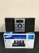 An LG micro Hi-Fi system together with a Samsung telephone fax machine