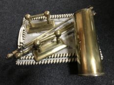 Two graduated trays, together with a large brass ammunition shell,