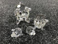 Four un-boxed Swarovski Crystal figures; pigs with piglets.
