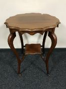 A late Victorian mahogany shaped occasional table