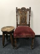A late Victorian heavily carved oak chair,