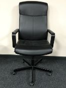 A contemporary high back swivel office armchair