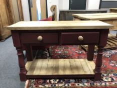 A painted pine two drawer side table with undershelf,