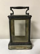 An antique brass carriage clock case