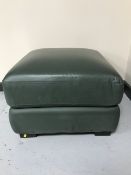 A green leather footstool